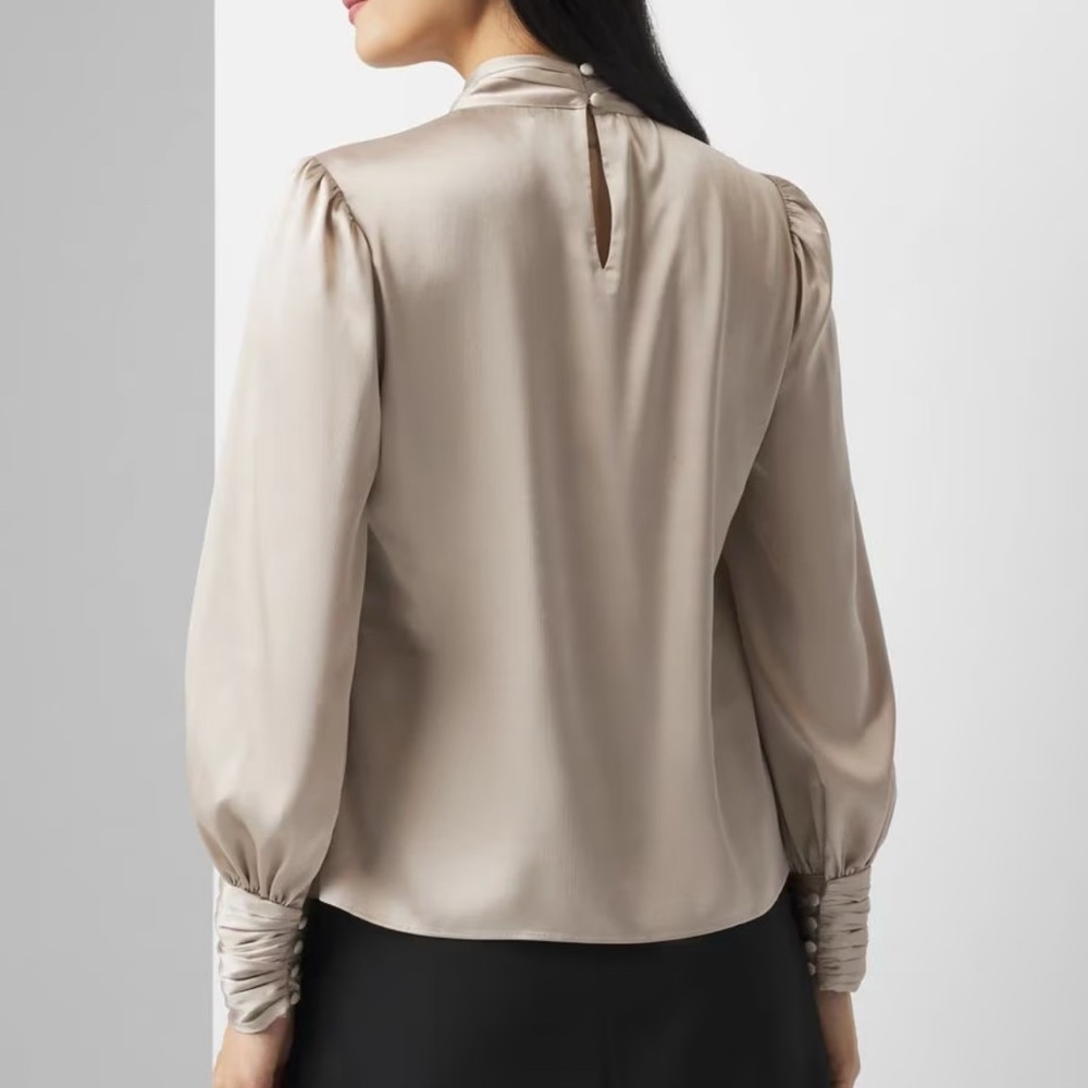 This satin blouse has a twisted neckline keyholes and blouson sleeves for flair - Picture 5 of 7
